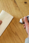 Osmo Easy Pad lint-free cloth being used on an oiled oak floor
